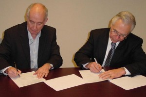 IRPA 13 Agreement :: International Organizing Committee Chairman, Roger Coates, and IRPA President, Ken Kase, sign the Agreement for IRPA 13